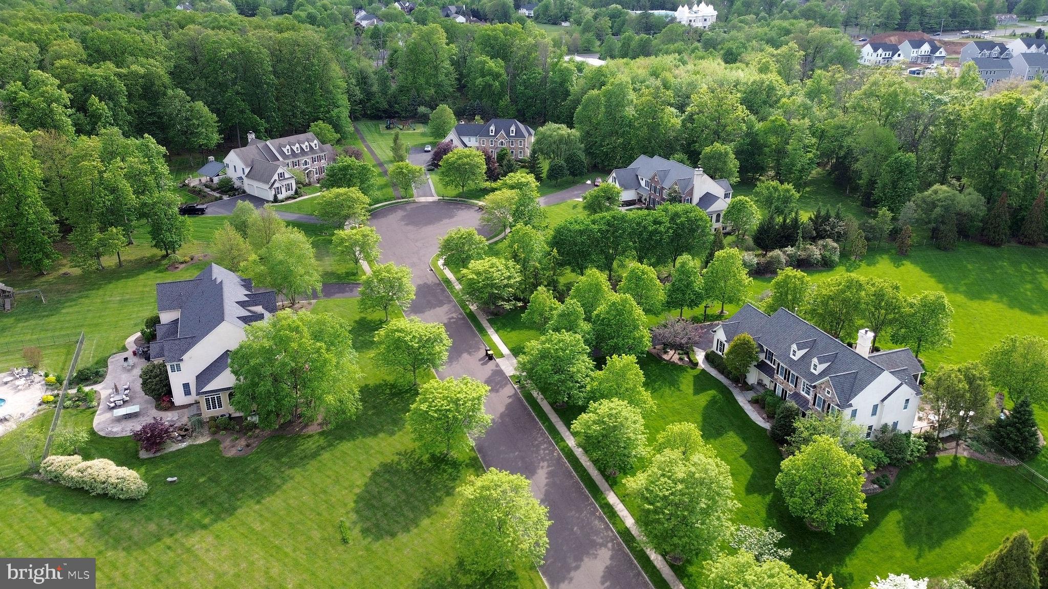 115 Muirfield Lane Chalfont, PA 18914 - Photo 54 of 59 an aerial view of lake residential houses with outdoor space and trees all around