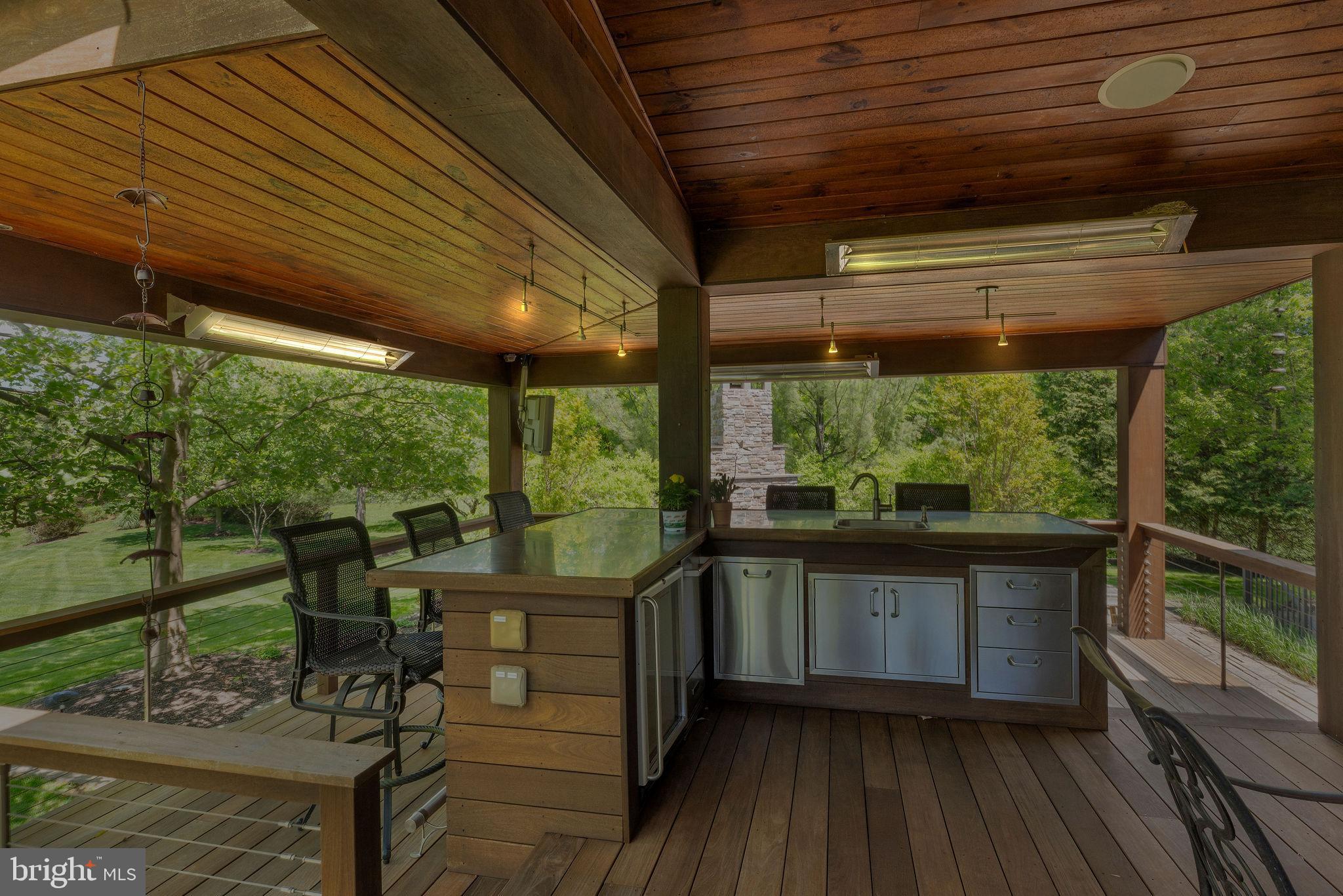 115 Muirfield Lane Chalfont, PA 18914 - Photo 56 of 59 a view of a porch with furniture and wooden floor