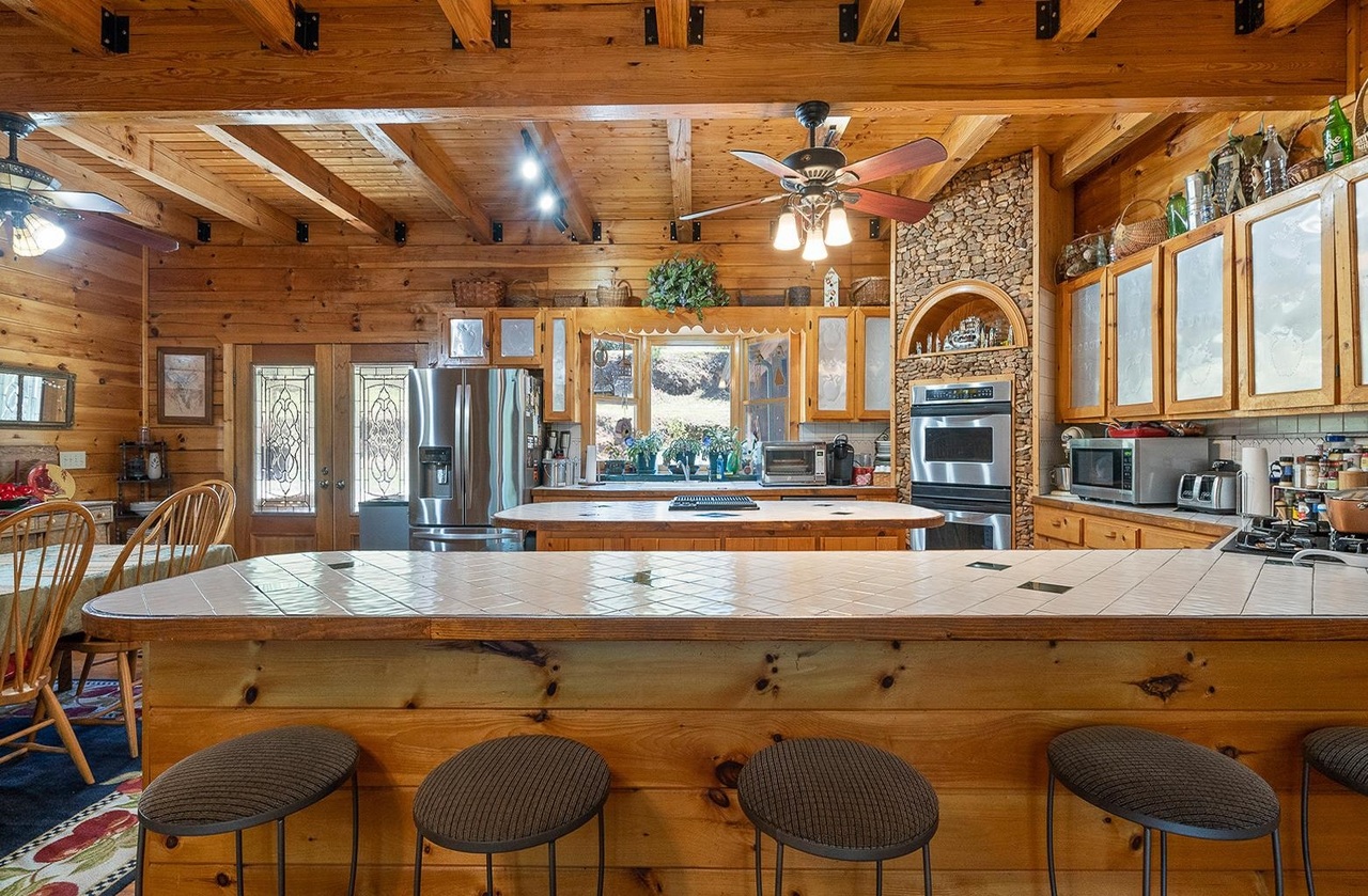2221 County Road 6 Wedowee, AL 36278 - Photo 15 of 40 an outdoor kitchen with a table and chairs