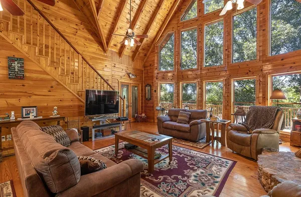 a living room with furniture and a flat screen tv