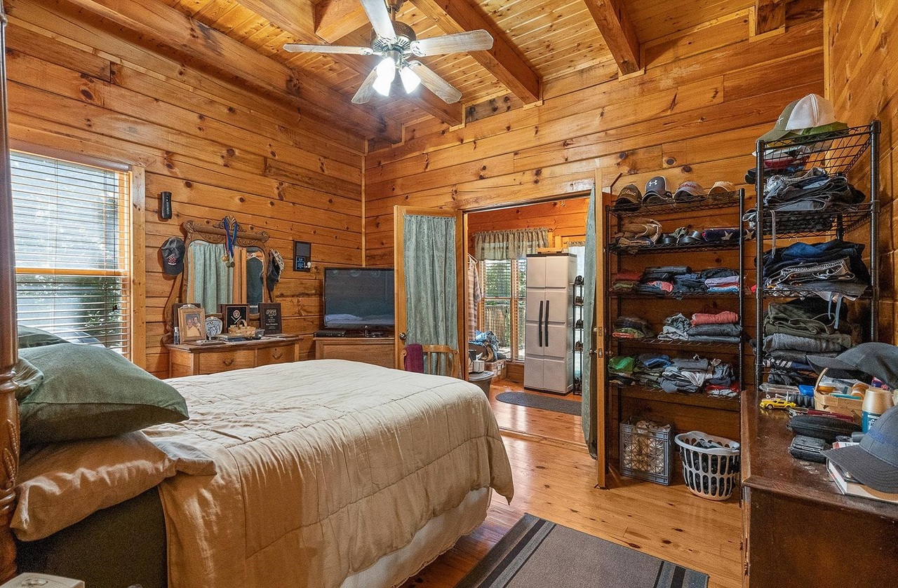 2221 County Road 6 Wedowee, AL 36278 - Photo 21 of 40 a bedroom with a bed a table and bookshelf