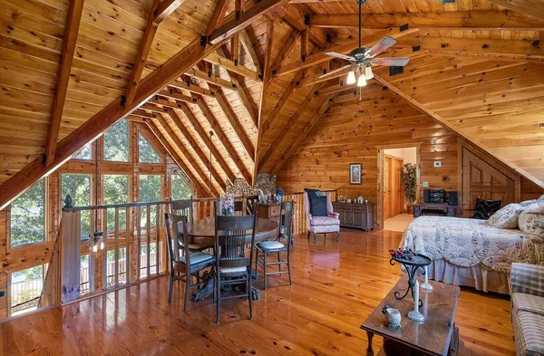 a bed room with a bed and a balcony