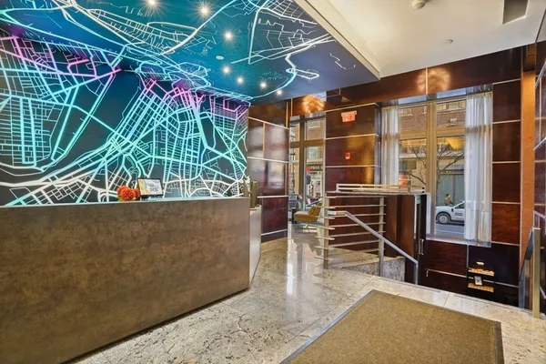 a view of entryway with wooden stairs