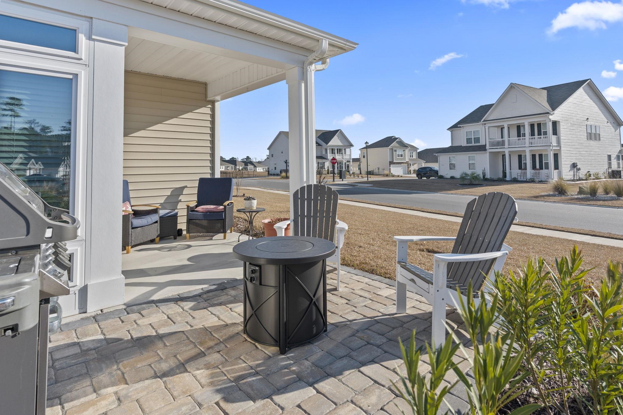 3111 Sutherland Drive Little River, SC 29566 - Photo 12 of 16 View of patio / terrace with a grill, a residential view, and a fire pit
