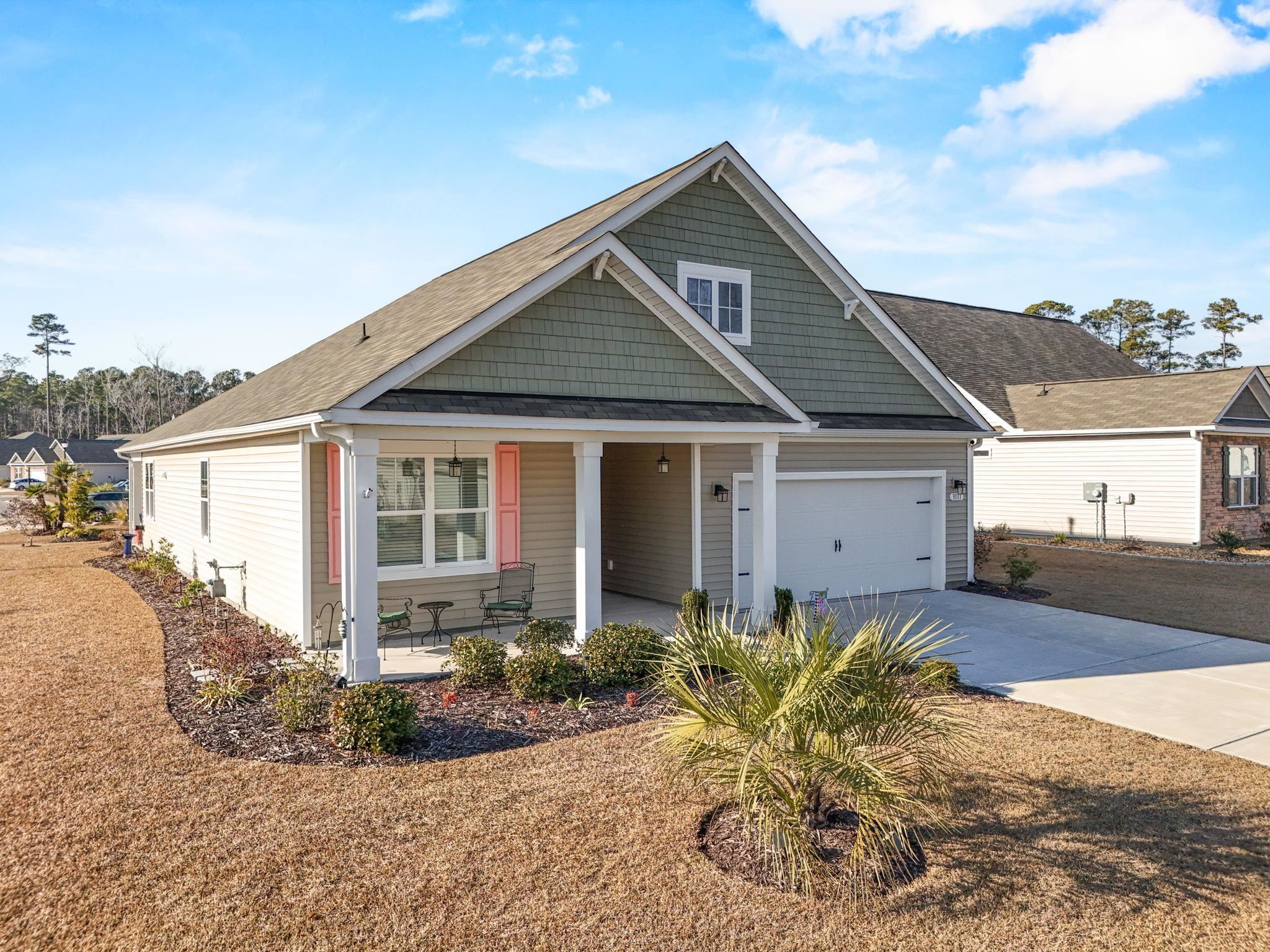 3111 Sutherland Drive Little River, SC 29566 - Photo 2 of 16 View of front of property with a porch, driveway, and a shingled roof