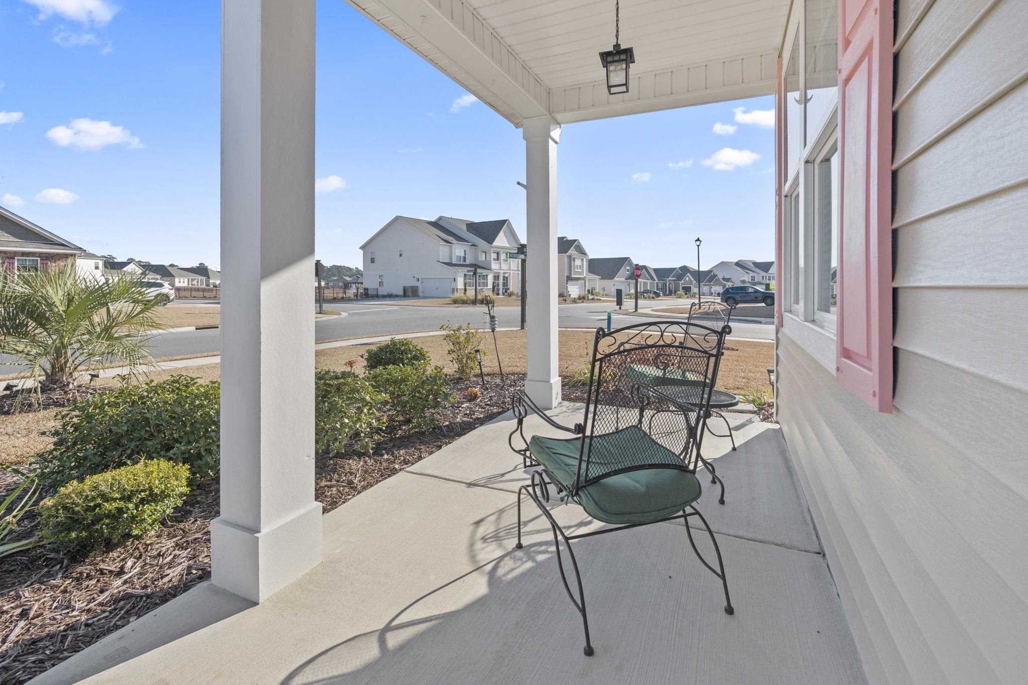 3111 Sutherland Drive Little River, SC 29566 - Photo 6 of 16 Covered porch with a residential view