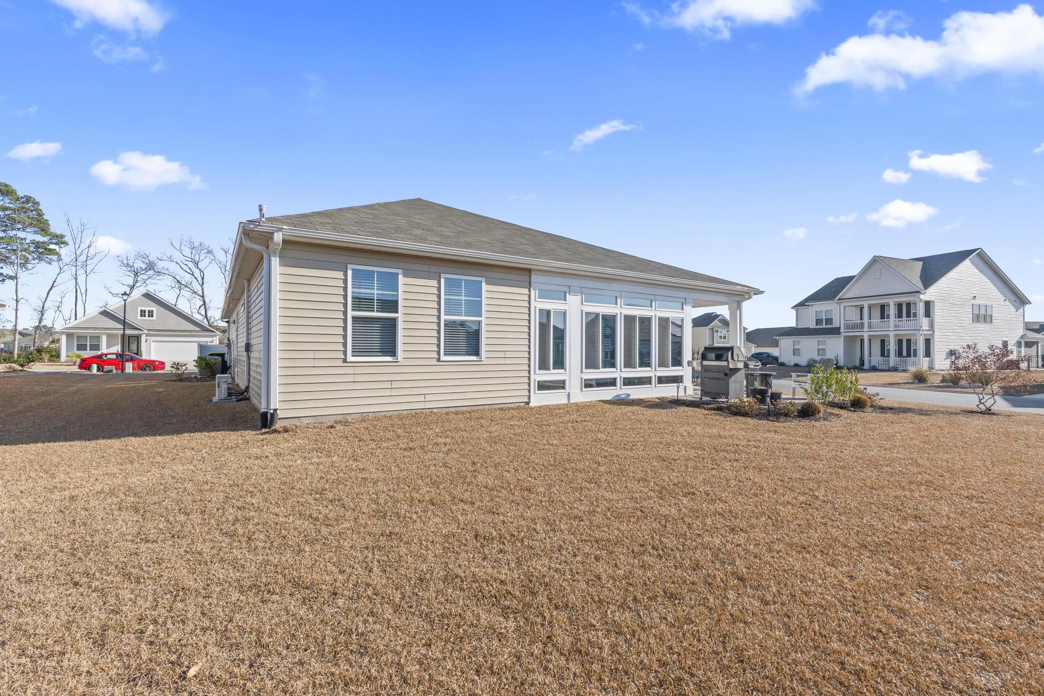 3111 Sutherland Drive Little River, SC 29566 - Photo 8 of 16 Rear view of house with a yard