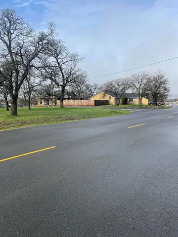 a view of road and trees