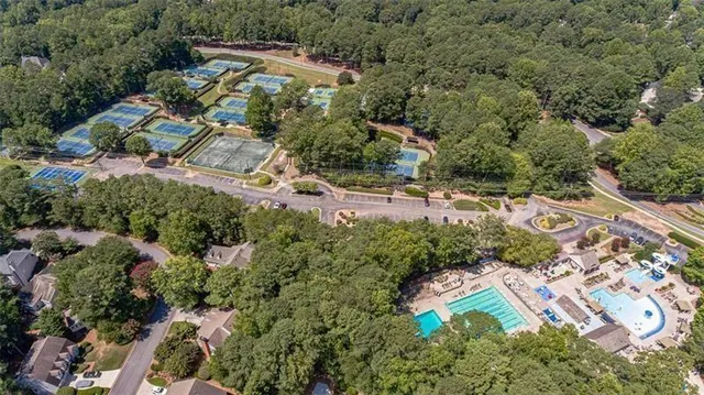 an aerial view of a house with a yard