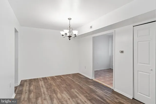 a view of a livingroom with a chandelier fan