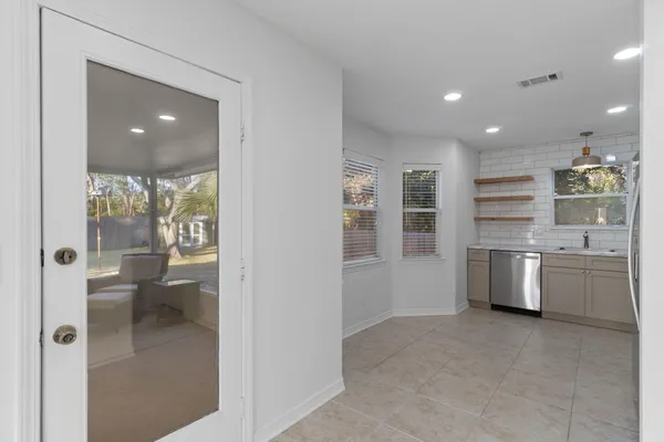 a view of a kitchen and a living room
