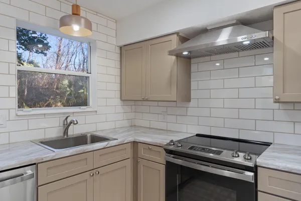 a kitchen with a sink and cabinets