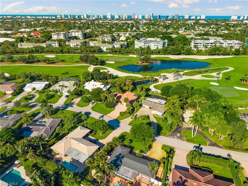 77 Cypress Point Drive Naples, FL 34105 - Photo 11 of 23 an aerial view of residential houses with outdoor space and parking