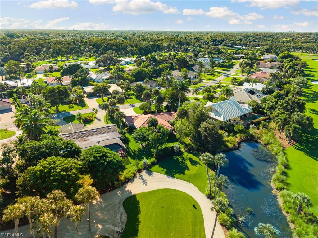 77 Cypress Point Drive Naples, FL 34105 - Photo 17 of 23 an aerial view of residential houses with outdoor space and trees