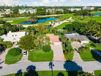 an aerial view of a house with yard swimming pool and outdoor seating
