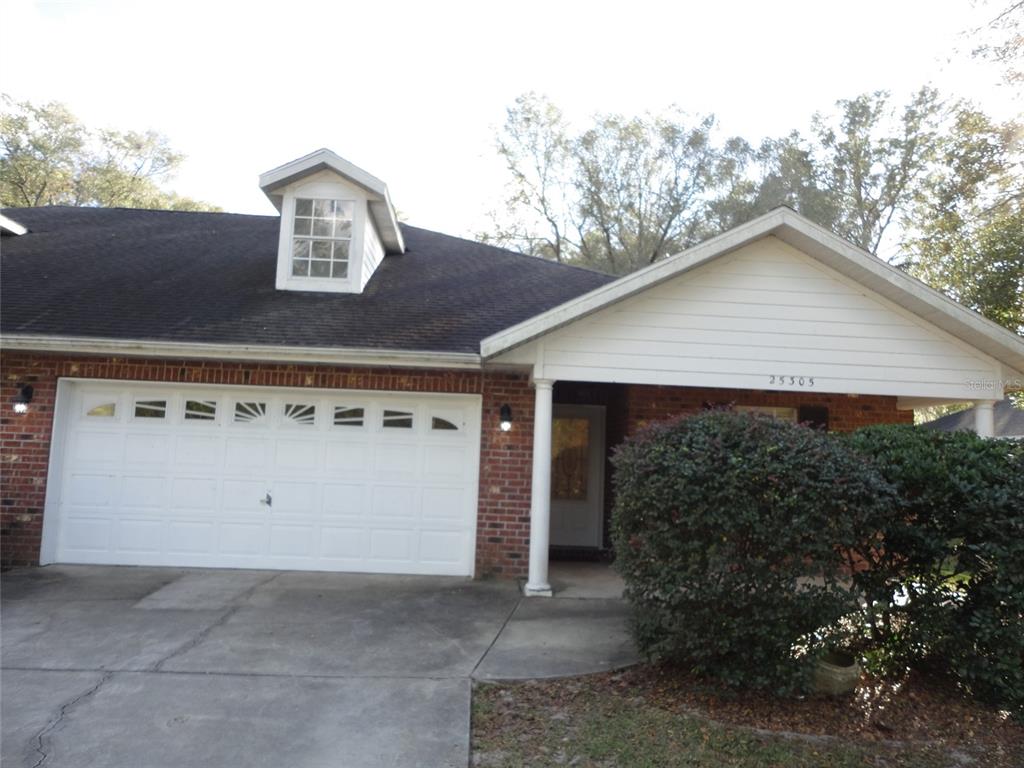a view of house with outdoor space