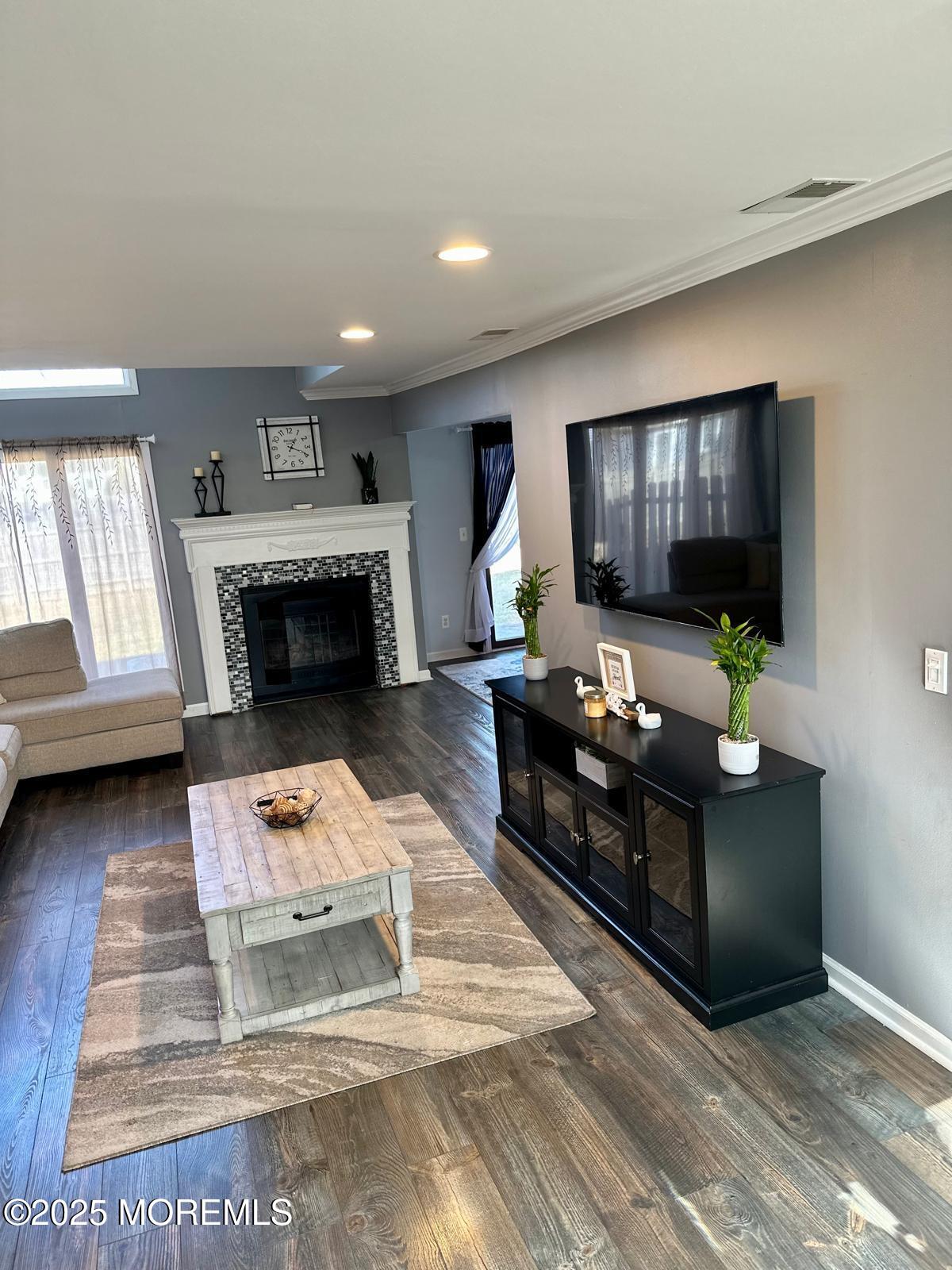 49 White Swan Way Brick, NJ 08723 - Photo 11 of 30 a living room with furniture and a fireplace