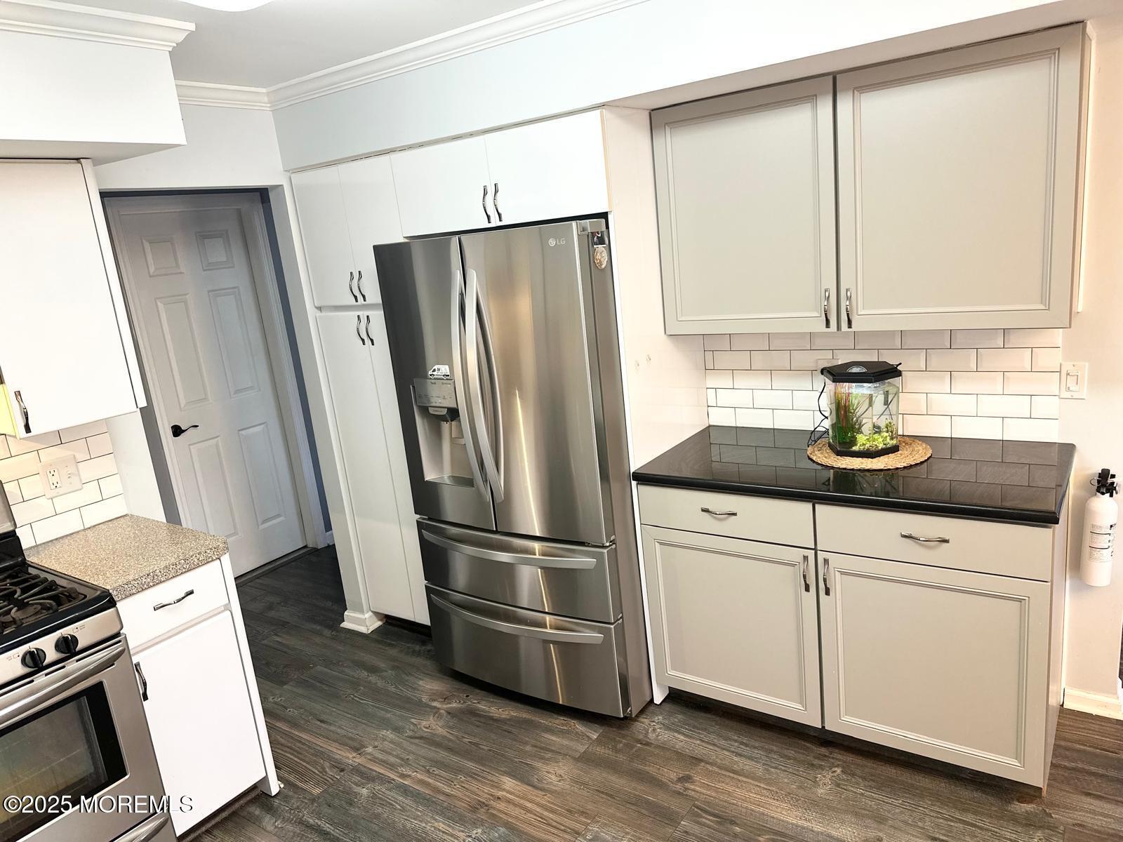 49 White Swan Way Brick, NJ 08723 - Photo 13 of 30 a kitchen with appliances a counter space and a window
