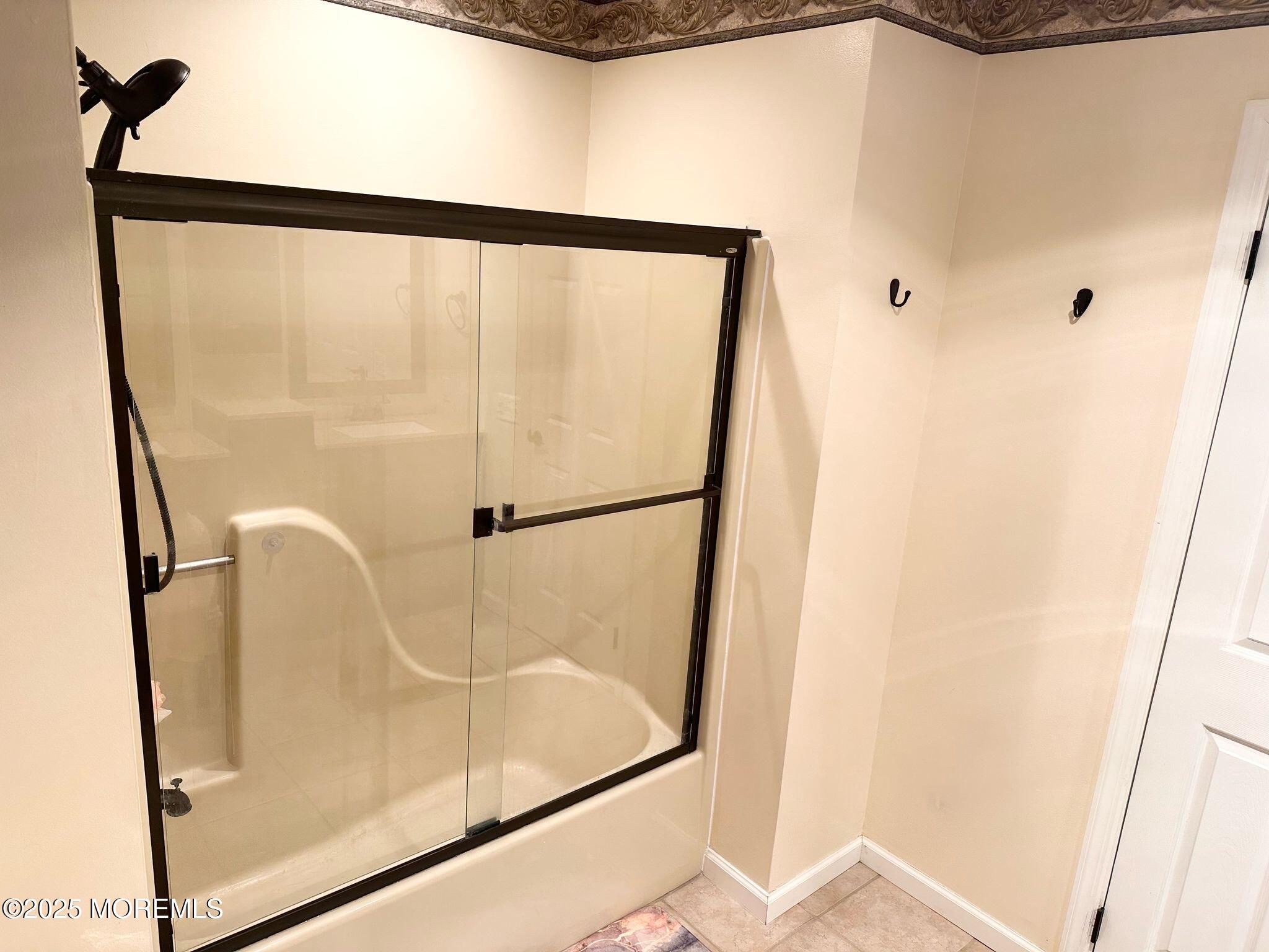 49 White Swan Way Brick, NJ 08723 - Photo 21 of 30 a bathroom with a glass shower door