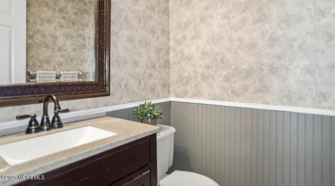 49 White Swan Way Brick, NJ 08723 - Photo 24 of 30 a bathroom with a sink and a toilet