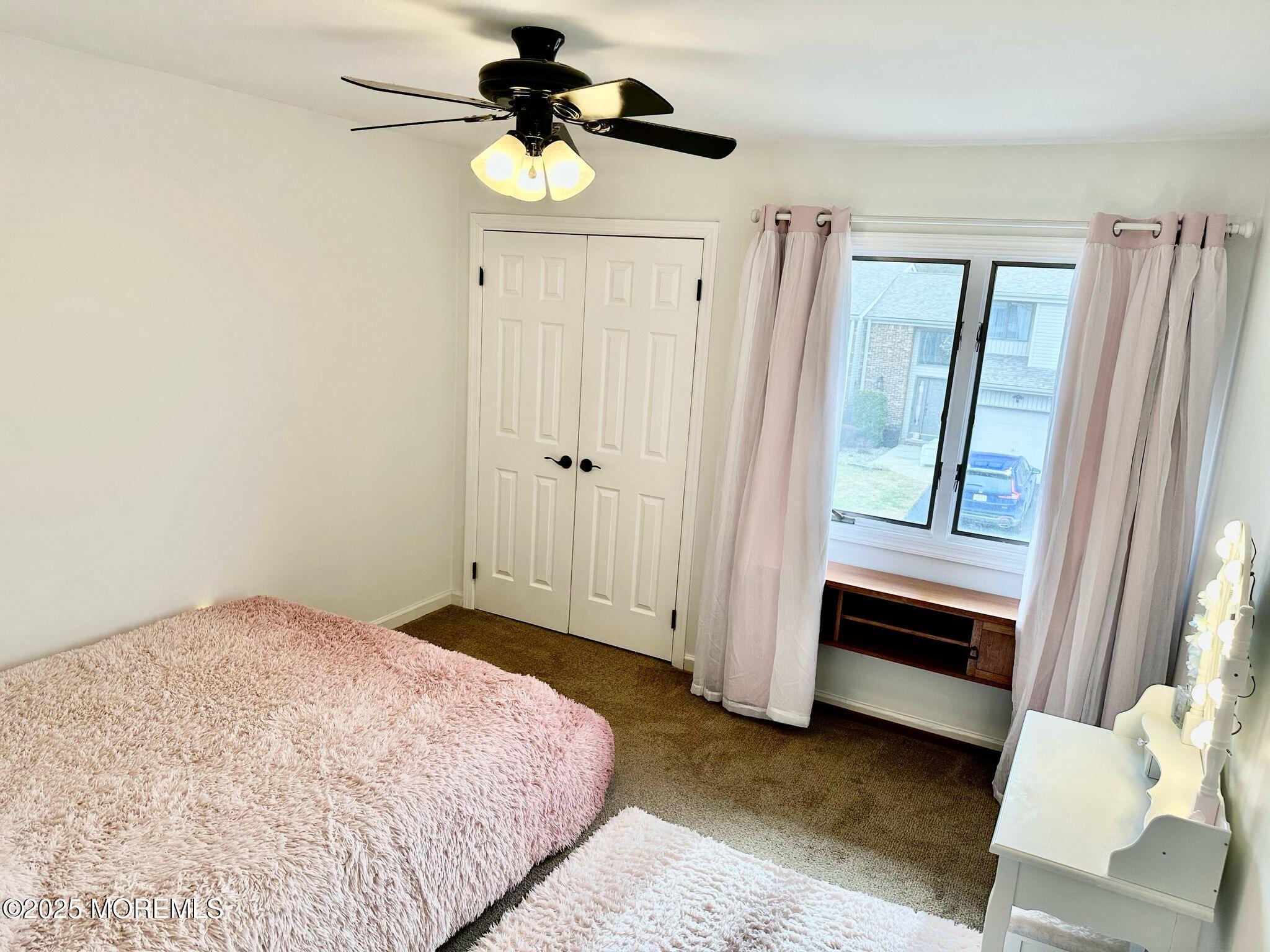 49 White Swan Way Brick, NJ 08723 - Photo 27 of 30 a bedroom with a bed and a window