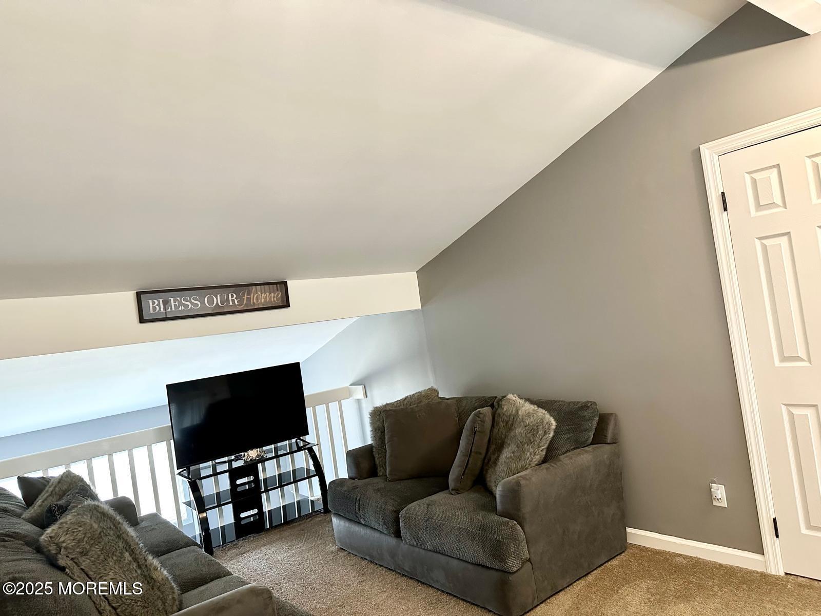 49 White Swan Way Brick, NJ 08723 - Photo 28 of 30 a living room with furniture and a flat screen tv