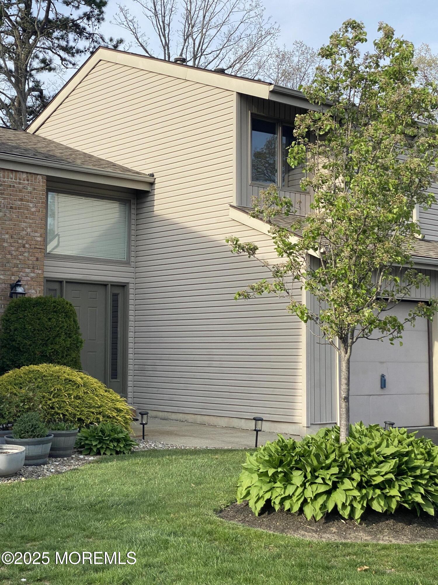 49 White Swan Way Brick, NJ 08723 - Photo 29 of 30 a view of a house with a yard