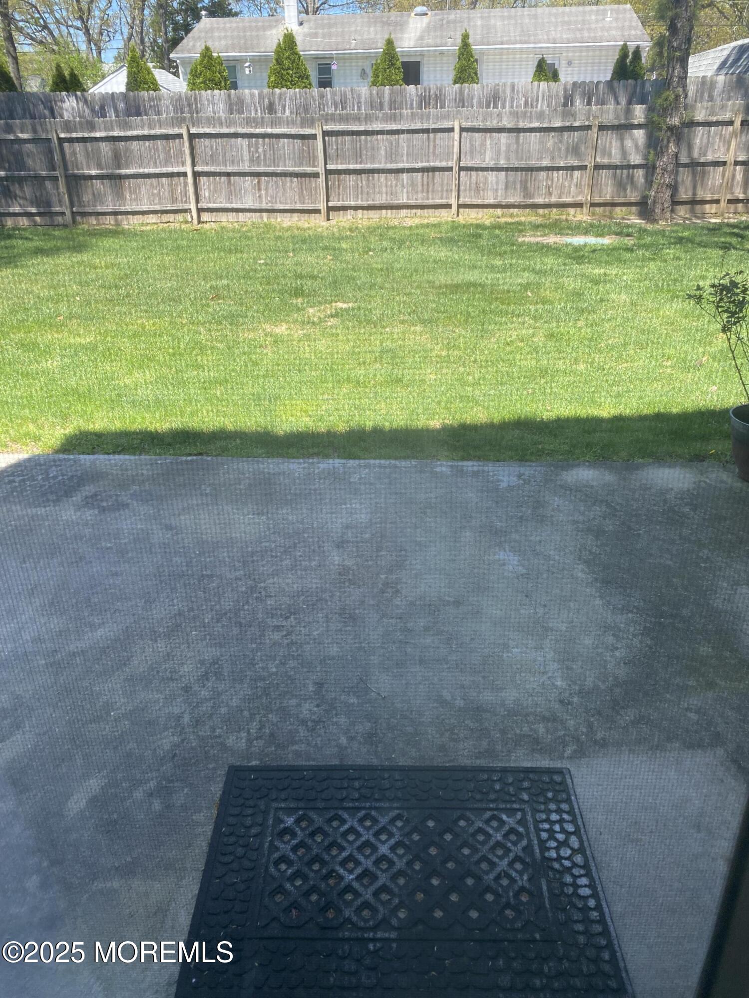 49 White Swan Way Brick, NJ 08723 - Photo 30 of 30 a view of a yard with wooden fence