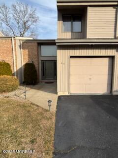 49 White Swan Way Brick, NJ 08723 - Photo 3 of 30 a view of a car garage door