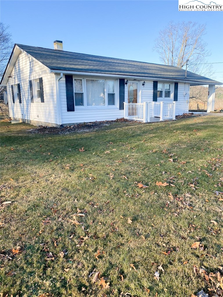 7874 Flat Ridge Road Troutdale, VA 24378 - Photo 1 of 37 a front view of a house with garden