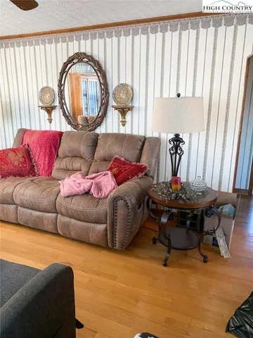 a living room with furniture a bathtub and a window