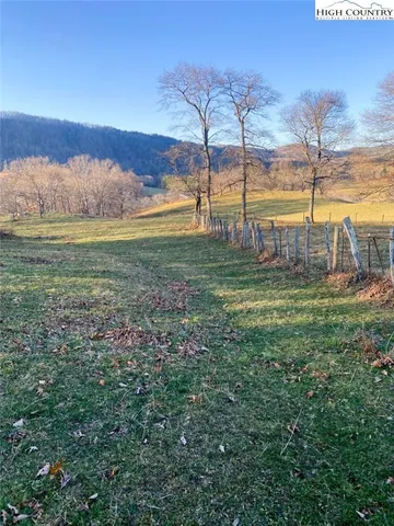 a view of a yard with an outdoor seating