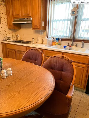 a blue white and blue chair sitting in a kitchen