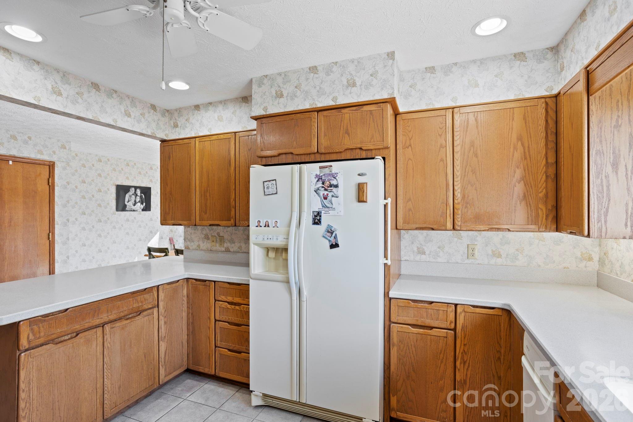 404 Browning Road Hendersonville, NC 28791 - Photo 12 of 46 a kitchen with stainless steel appliances a refrigerator and a sink