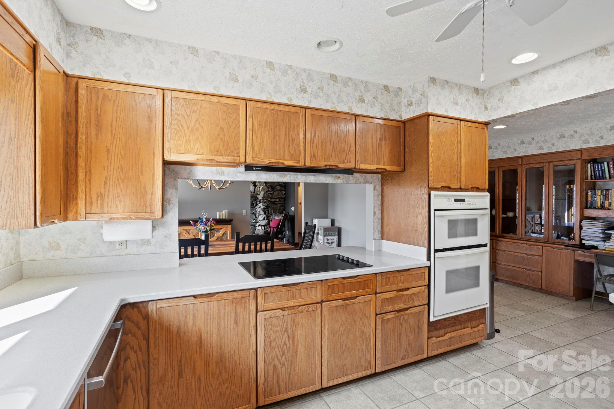404 Browning Road Hendersonville, NC 28791 - Photo 13 of 46 a kitchen with stainless steel appliances granite countertop a sink window and cabinets