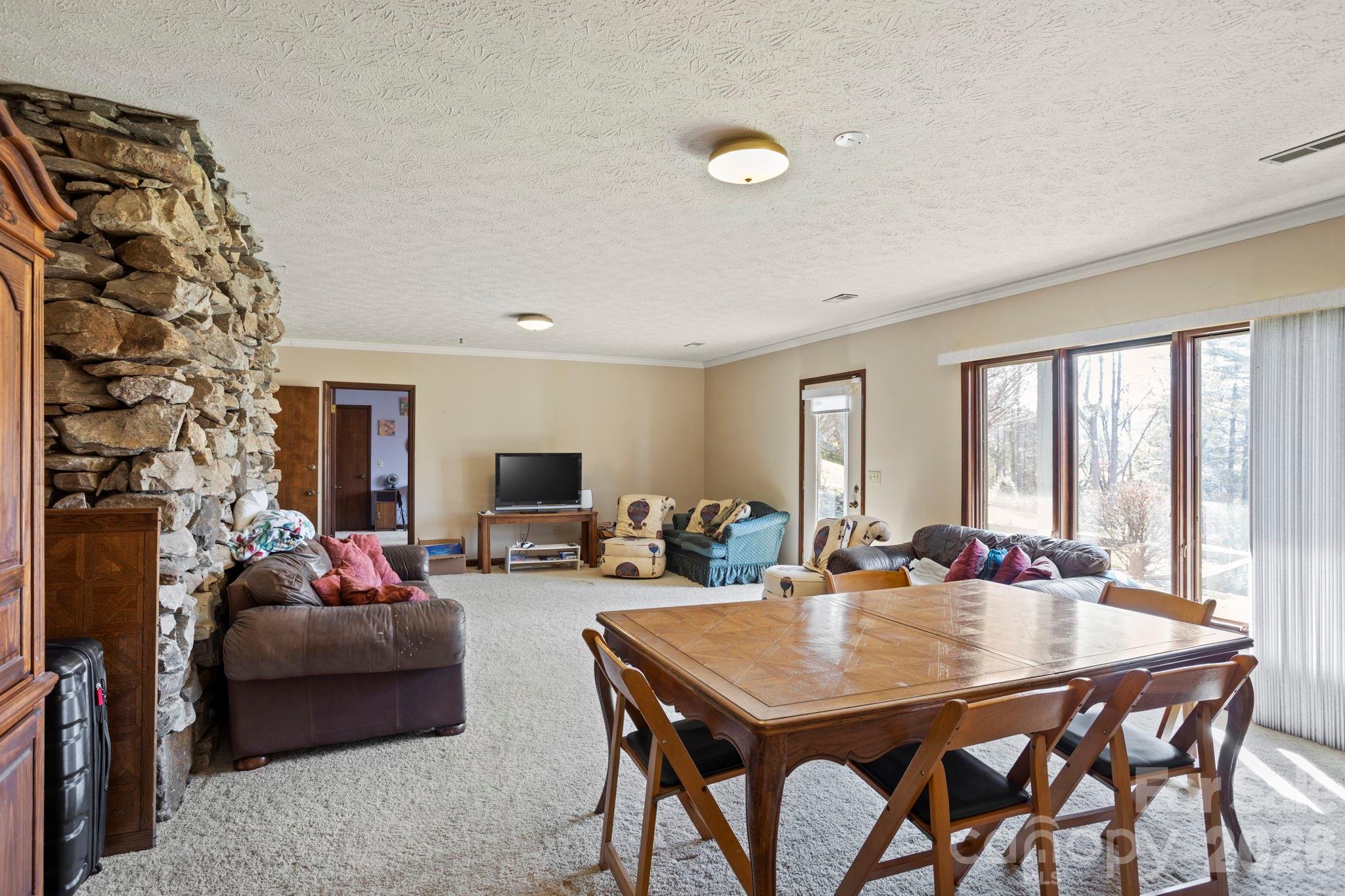 404 Browning Road Hendersonville, NC 28791 - Photo 24 of 46 a view of a dining room with furniture and wooden floor