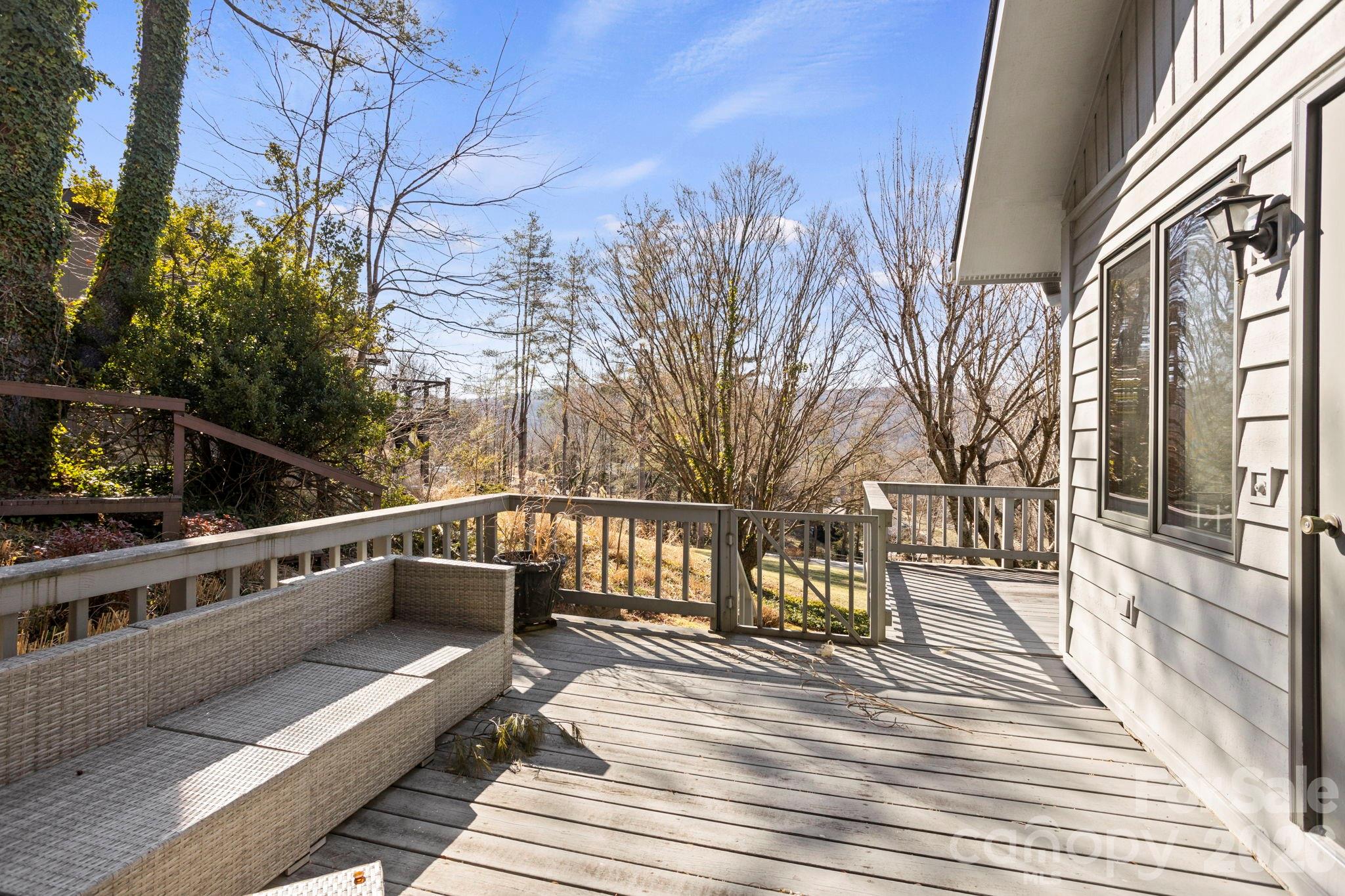 404 Browning Road Hendersonville, NC 28791 - Photo 33 of 46 a view of a roof deck with couches and wooden floor