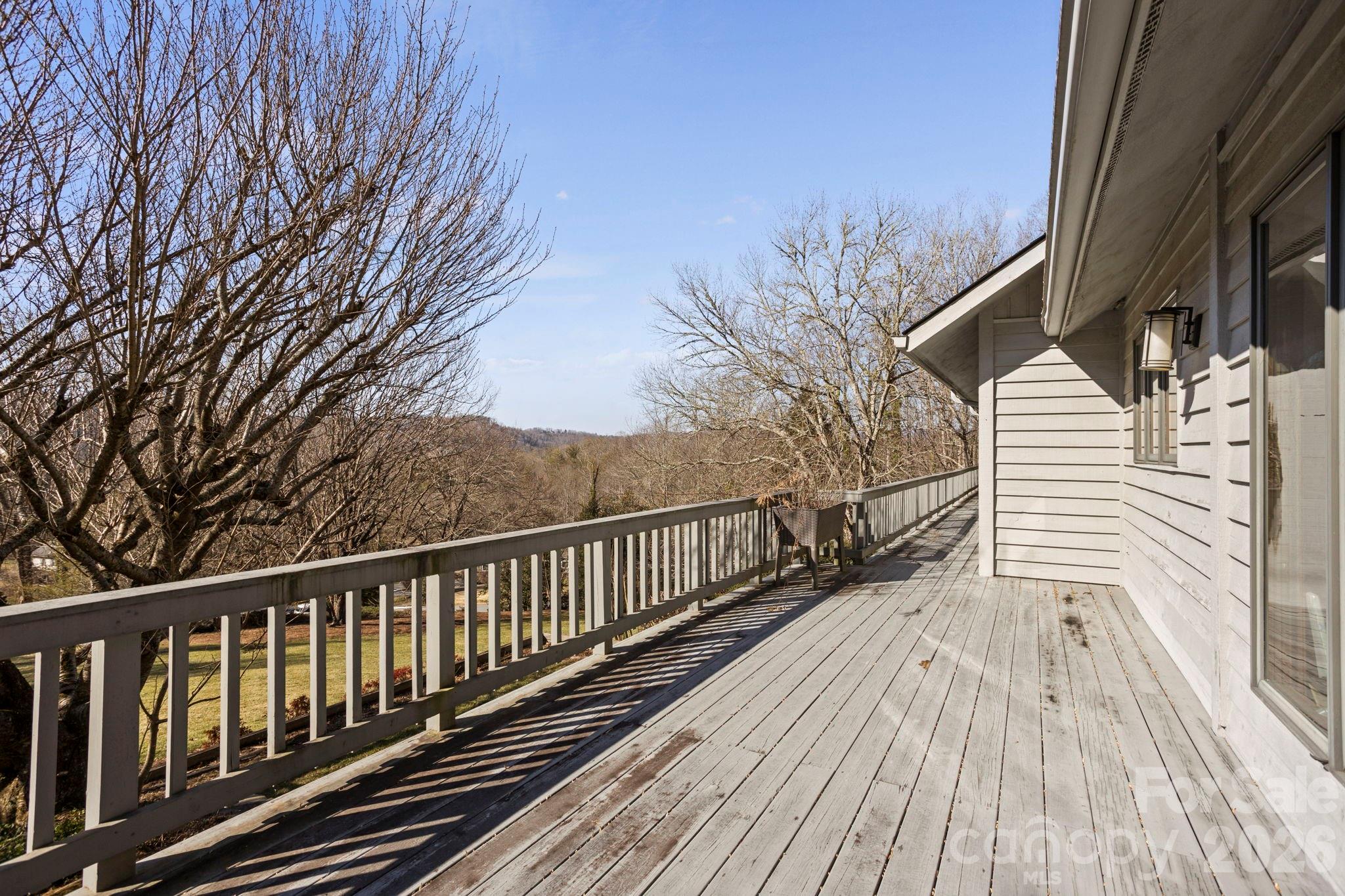 404 Browning Road Hendersonville, NC 28791 - Photo 34 of 46 a porch with wooden floor and fence
