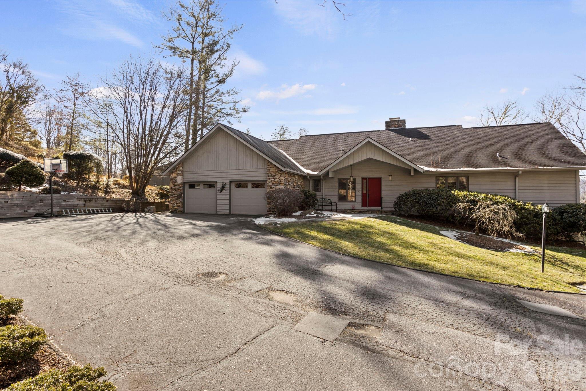 404 Browning Road Hendersonville, NC 28791 - Photo 43 of 46 a view of house with a yard and large tree
