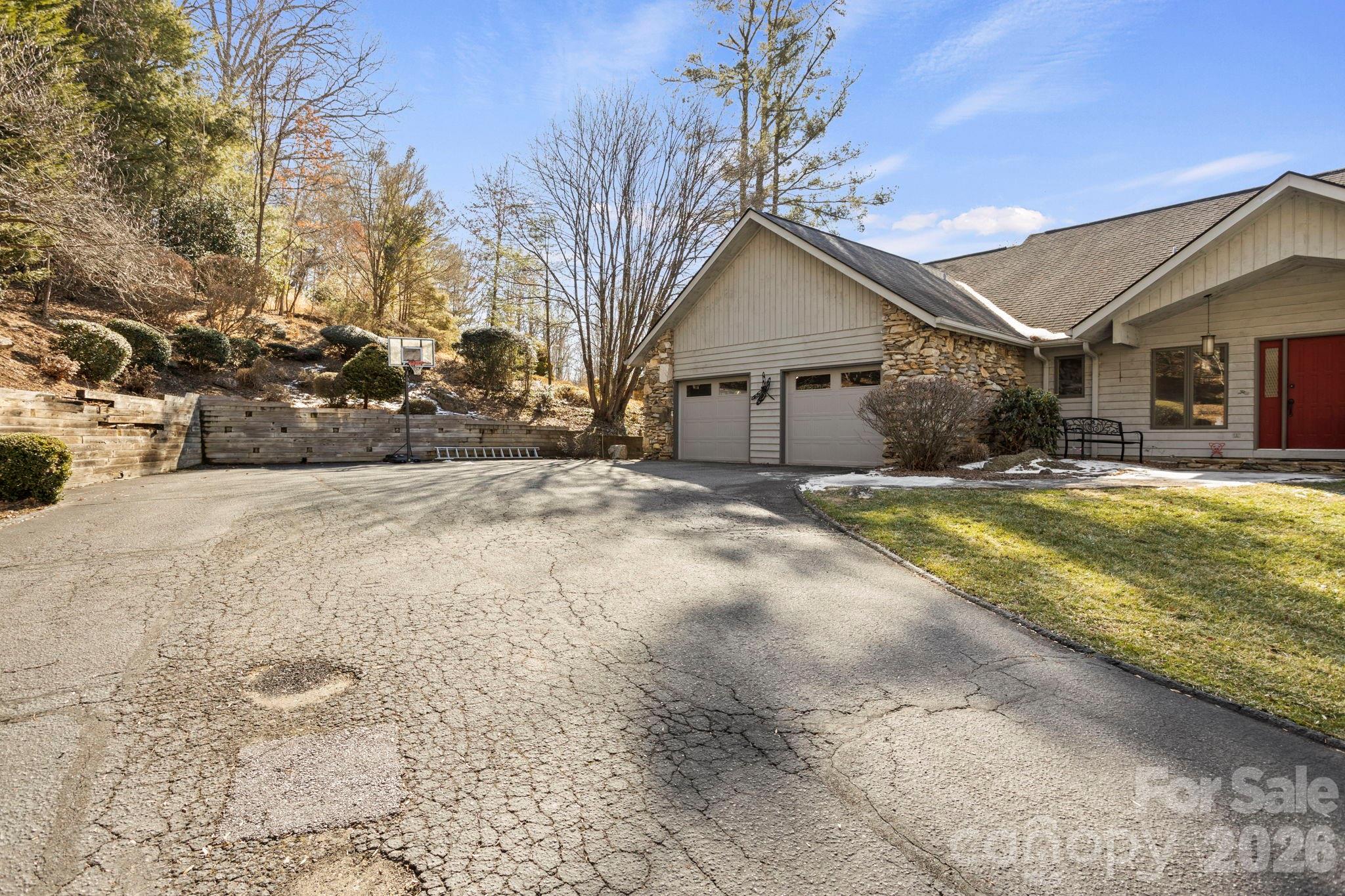 404 Browning Road Hendersonville, NC 28791 - Photo 44 of 46 a view of a house with a yard covered with snow