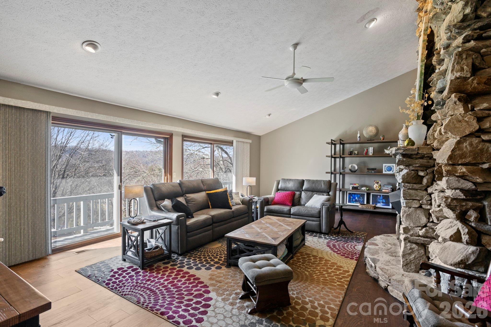 404 Browning Road Hendersonville, NC 28791 - Photo 6 of 46 a living room with furniture and a floor to ceiling window