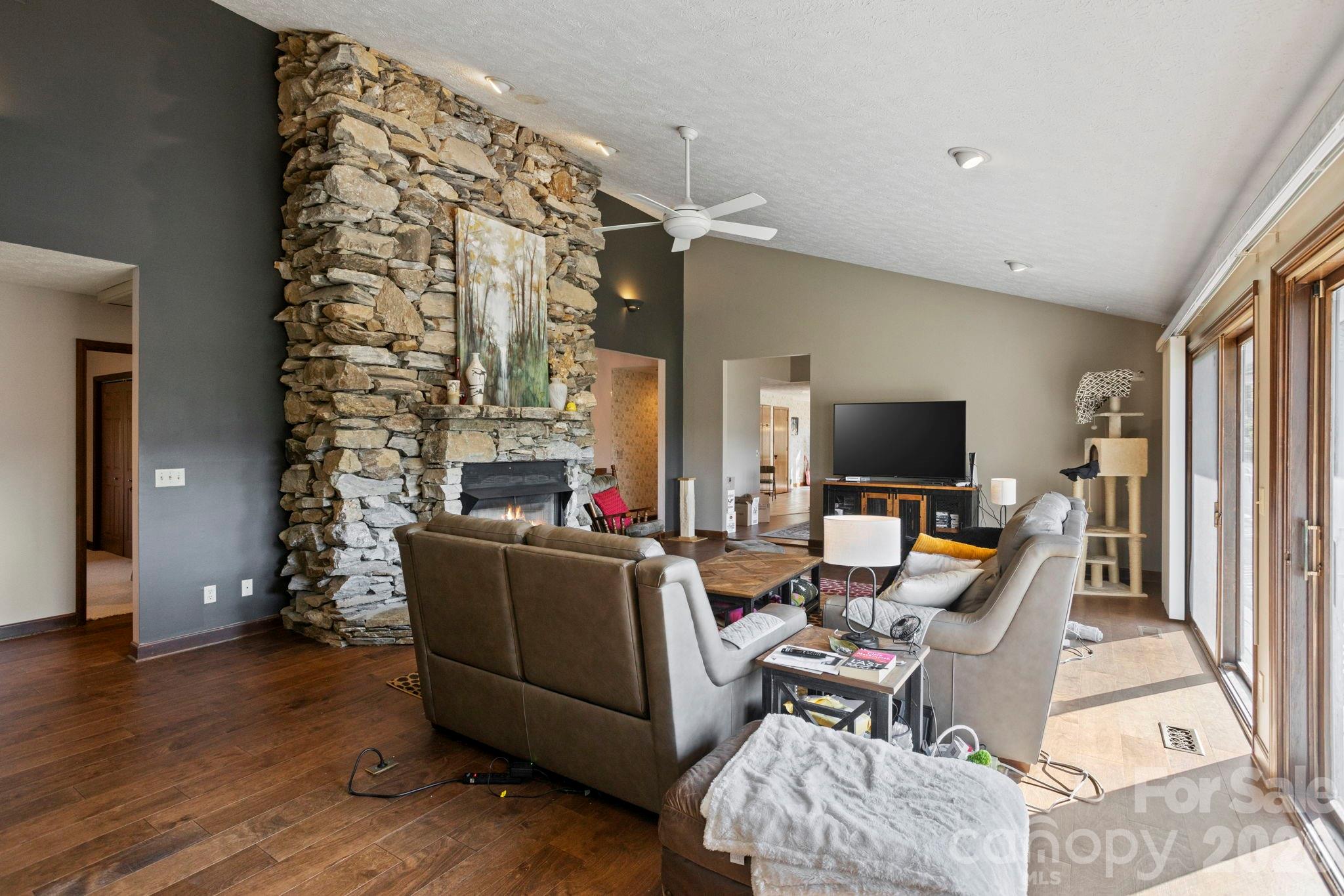 404 Browning Road Hendersonville, NC 28791 - Photo 8 of 46 a living room with furniture and a flat screen tv