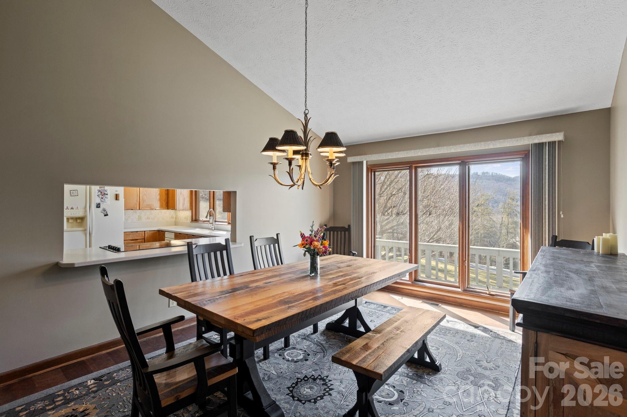 404 Browning Road Hendersonville, NC 28791 - Photo 10 of 46 a living room with furniture a table and a large window