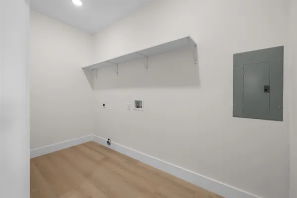 a spacious bathroom with a toilet sink and mirror