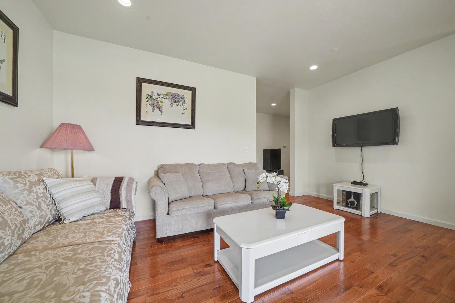 6066 Bluff View Road Copperopolis, CA 95228 - Photo 56 of 96 a living room with furniture and a flat screen tv