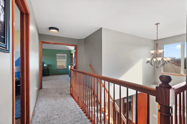 a view of a hallway view with staircase