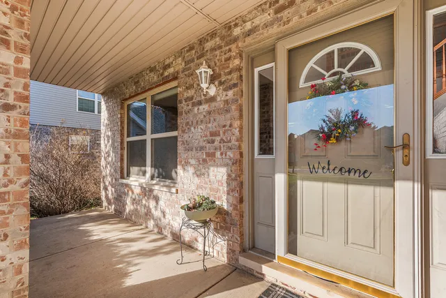 a view of a door and a sign on the wall
