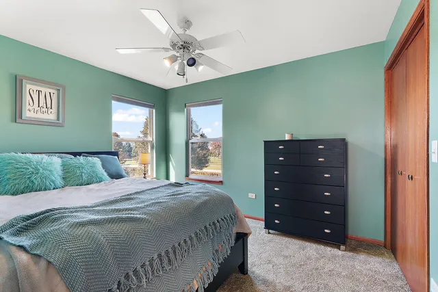 a bedroom with a bed and a dresser