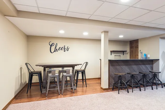 a view of a room with furniture and a table