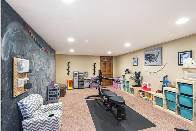 a view of a livingroom with workspace and a couch